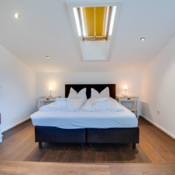 Gemütliches Schlafzimmer in Villa Perfall17, Schliersee – ideal für einen entspannten Urlaub. Buchen Sie jetzt bei stayFritz.